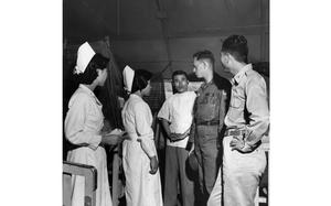 Gwangju, South Korea, July 8, 1959: Staff members at the 77th Army Hospital near discuss problems with Dr. (Capt.) Vernon Hendrix (second from right), medical officer of Detachment K, U.S. Army Advisory Group,  Korea, at Sang Mu Dae. The American doctor advises several ROK hospitals and checks the health of orphans near his detachment's headquarters in his spare time. He knows the medical problems in his area through trips he has made to six provincial hospitals not too far from Sang Mu Dae. 

Looking for Stars and Stripes’ historic coverage? Subscribe to Stars and Stripes’ historic newspaper archive! We have digitized our 1948-1999 European and Pacific editions, as well as several of our WWII editions and made them available online through https://starsandstripes.newspaperarchive.com/

META TAGS: Pacific; South Korea; Kwangju; Korean Military Advisory Group; KMAG; military medical; locals; South Koreans; ROK; hospital; nurse