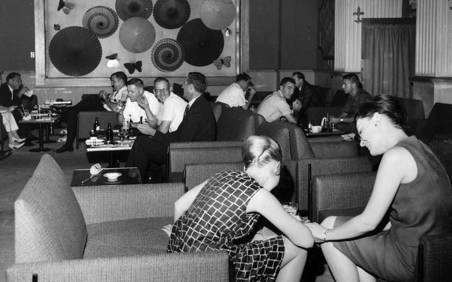 Young guests and visitors drink and chat in the cocktail lounge of the Sanno Hotel