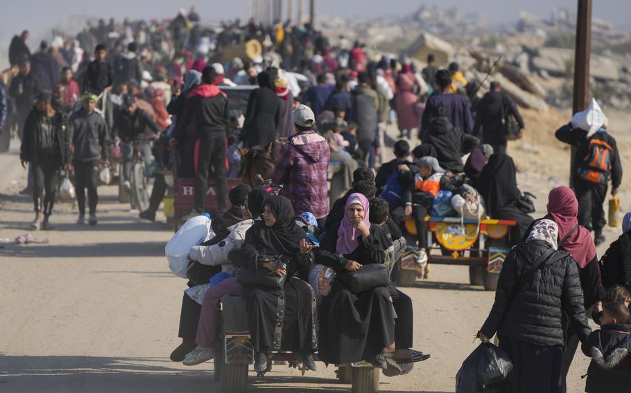 Displaced Palestinians walk on a road in central Gaza to return to their homes in the northern Gaza Strip, Wednesday, Jan. 29, 2025.