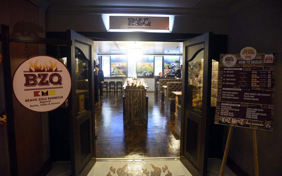 A restaurant interior is partially visible from just outside the main entrance.