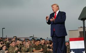 President Donald Trump appears before U.S. service members and their families at Osan Air Base, South Korea, June 30, 2019. 
