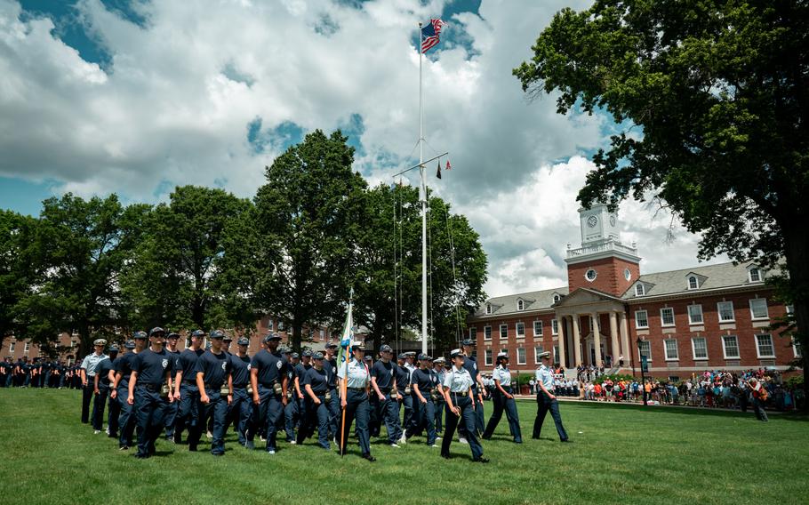 Members of the Coast Guard Academy Class of 2028 march at the service academy in New London, Conn. 
