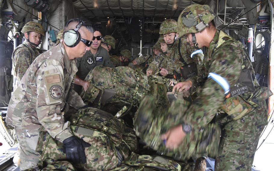 Japan Ground Self-Defense Force soldiers embark on a U.S. C-130J  Super Hercules during a Valiant Shield exercise at Yokota Air Base, Japan, on Saturday, June 15, 2024. 