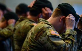 New Special Forces soldiers don their Green Berets for the first time during their Special Forces Qualification Course graduation on Jan. 23, 2025 in Fayetteville, N.C. (Corey Dickstein/Stars and Stripes)