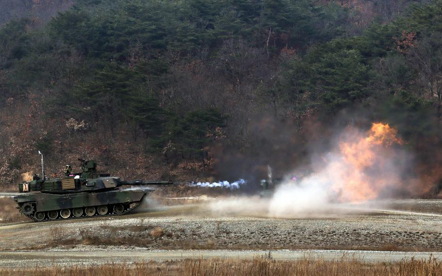 An M1A2 Abrams tank fires its 120mm cannon at Rodriguez Live Fire Range, South Korea, Nov. 28, 2017.