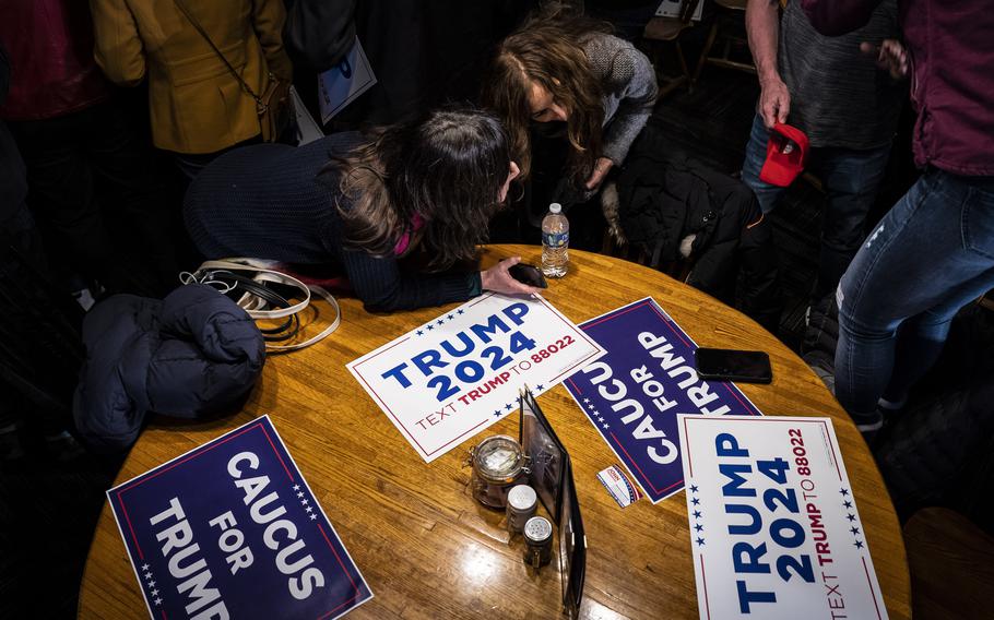 Supporters speak as Donald Trump Jr. campaigns for his father, former president Donald Trump, at the Machine Shed on Jan. 11, 2024, in Urbandale, Iowa. 