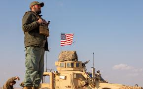 U.S. Army infantrymen assigned to Task Force Armadillo patrol with a Syrian Free Army soldier in al-Tanf, Syria, on Jan. 11, 2025. The U.S. has a force of 2,000 service members deployed to Syria, but President Donald Trump's plans for the mission are under review.