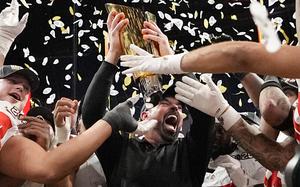 Ohio State head coach Ryan Day celebrates with the trophy after their win against Notre Dame in the College Football Playoff national championship game Monday, Jan. 20, 2025, in Atlanta. (AP Photo/Brynn Anderson)