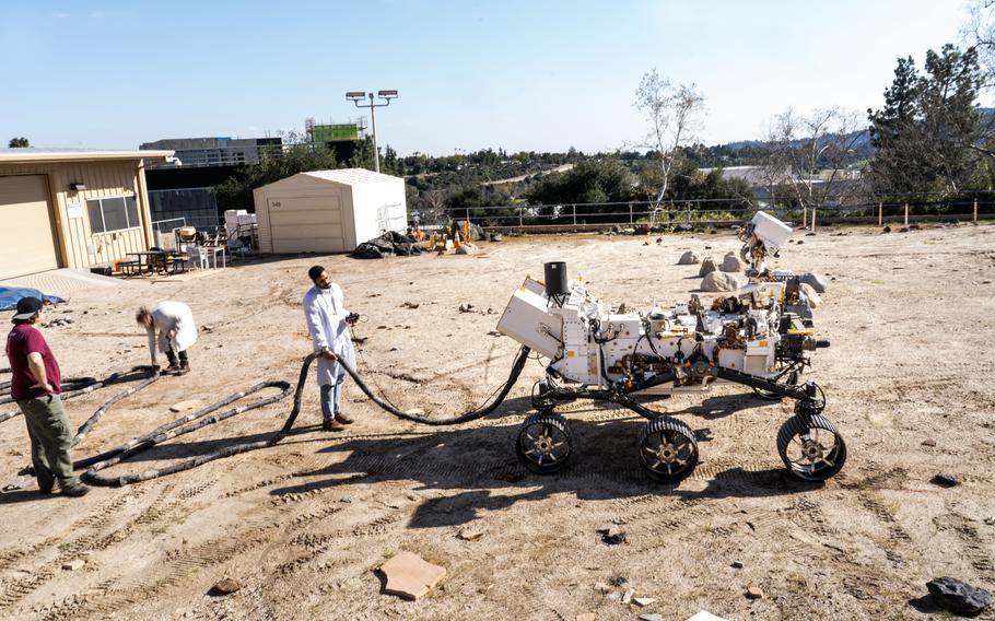 The Mars rover, guided by NASA employees, at the Joint Propulsion Laboratory.