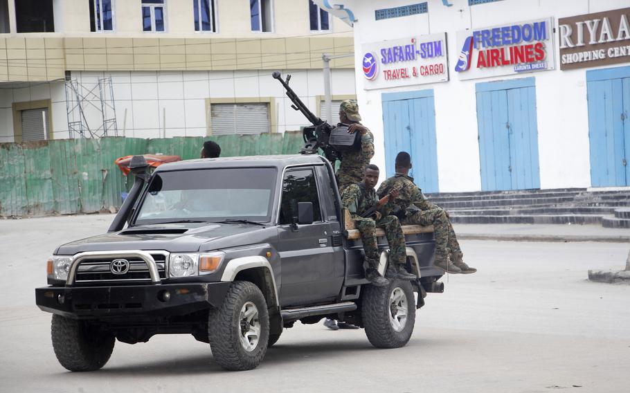 Soldiers patrol outside the Hayat Hotel in Mogadishu, Somalia, Saturday Aug, 20, 2022. 