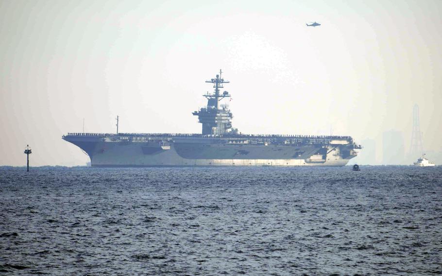 The USS George Washington arrives at Yokosuka Naval Base in Japan.