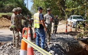 Soldiers assigned to the 20th Engineer Brigade, XVIII Airborne Corps and 2nd Brigade, 82nd Airborne Division work together with the Fairview community to assess damage after Hurricane Helene in Fairview, North Carolina, Oct. 5, 2024. The XVIII Airborne Corps are working side-by-side with state and local officials to ensure that critical supplies and support are delivered to our fellow North Carolinians. (U.S. Army photo by Sgt. Alison Strout)