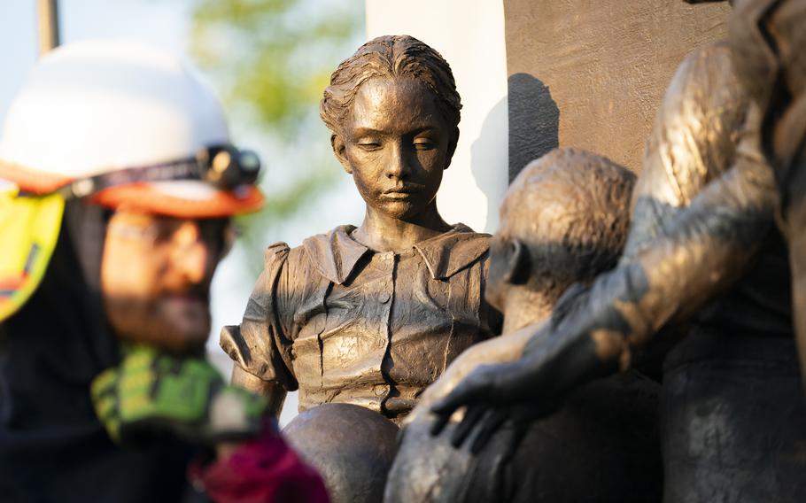 Sculptors work on finishing touches