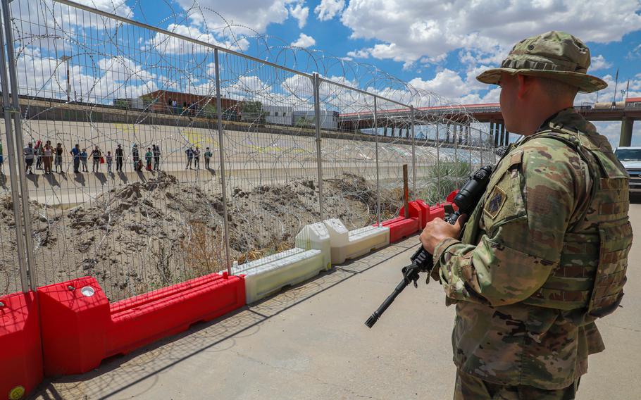 An Oklahoma National Guard soldier patrols a border fence along the Rio Grande in El Paso, Texas, Aug. 16, 2023. Proposals under the Heritage Foundation's Project 2025 include increasing military support for border security operations. Former President Donald Trump has suggested an expanded role for active-duty troops at the border.