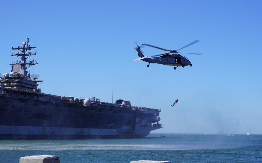 The U.S. Navy Helicopter Sea Combat squadron does a search and rescue demonstration in the water