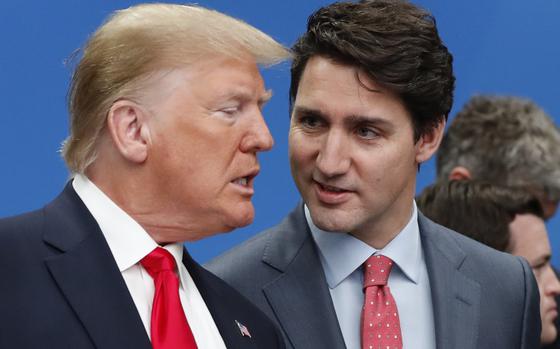 FILE - U.S. President Donald Trump, left, and Canadian Prime Minister Justin Trudeau talk prior to a NATO round table meeting at The Grove hotel and resort in Watford, Hertfordshire, England, Dec. 4, 2019. (AP Photo/Frank Augstein, File)