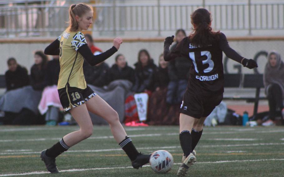 Lauren Haith tries to maintain possession.