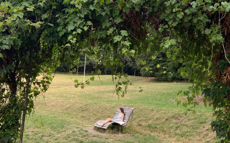 Someone relaxes in a chair at the Ohmbachsee in Gries, Germany.