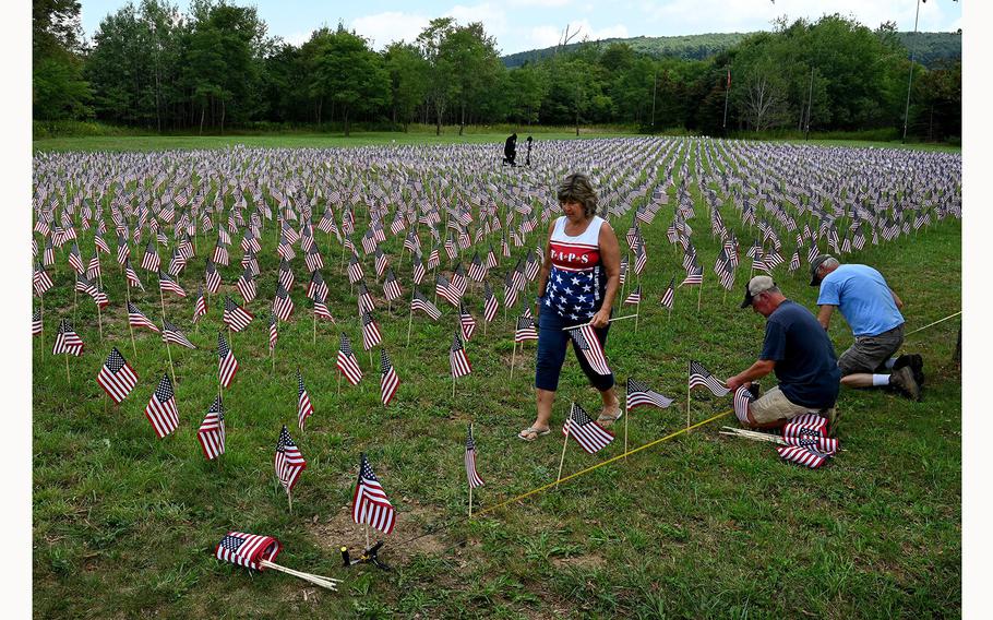Small U.S. flags are placed near the Flight 93 National Memorial in Somerset County, Pa., on Aug. 23, 2021, as a tribute to all the military members who died during the global War on Terror that followed the Sept.11, 2001 attacks. 