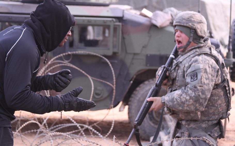 Then-Pfc. Austin Wecker, right, engages a role player during a field training exercise at Seosan Air Base, South Korea, in 2014. Wecker, who rose to staff sergeant, was convicted April 29, 2024, of rape and sexual offenses against children during a general court-martial in Kaiserslautern, Germany.