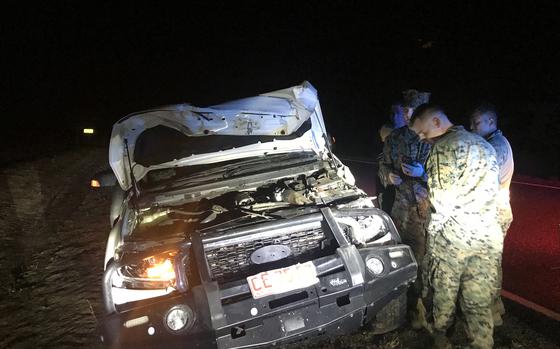 U.S. Marines emerged unscathed after their vehicle collided with a water buffalo on Arnhem Highway southeast of Darwin, Australia, Wednesday, July 24, 2024. 