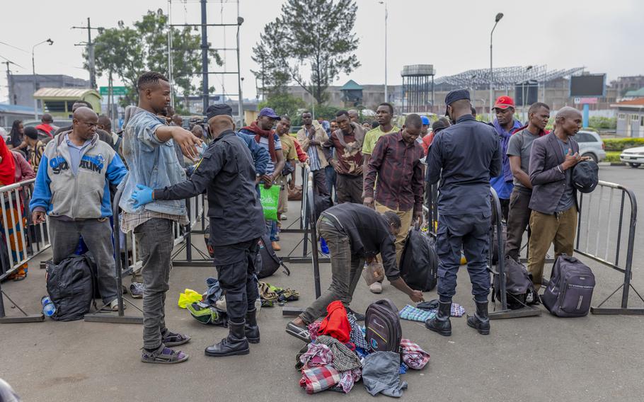 Rwanda security officials check people crossing from Congo in Gyseny, Rwanda, Tuesday, Jan. 28, 2025, following M23 rebels’ advances into eastern Congo’s capital Goma. 