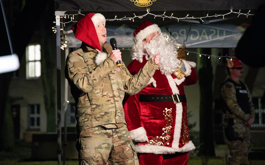 Col. Jesse Chace stands next to Santa.