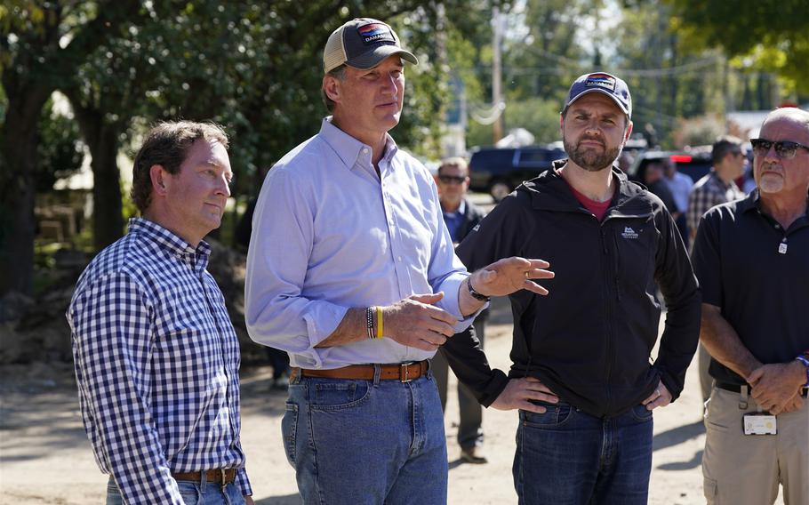 Virginia Gov. Glenn Youngkin speaking next to Sen. JD Vance and a state senator in Damascus, Va., Oct. 3, 2024.