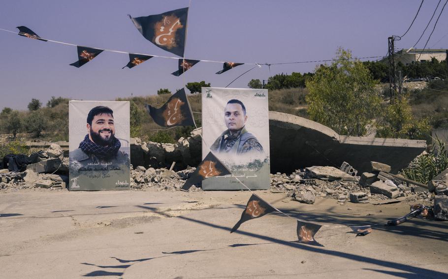 Images of Hezbollah fighters who died in the cross-border conflict with Israel are placed on the site of an Israeli airstrike in southern Lebanon’s Wadi Jilo.