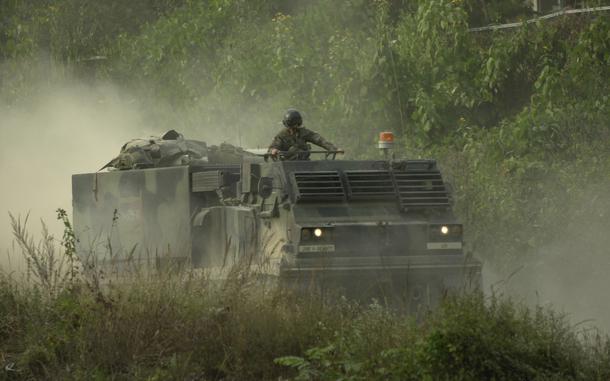 A (MLRS) multiple launch rocket system vehicle comes down the range to empty the rocket pods after a successful firing of the system. 