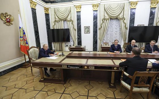 Russian President Vladimir Putin, left, speaks at the Security Council meeting on nuclear deterrence at the Kremlin in Moscow, Russia, Wednesday, Sept. 25, 2024. (Alexander Kazakov, Sputnik, Kremlin Pool Photo via AP)