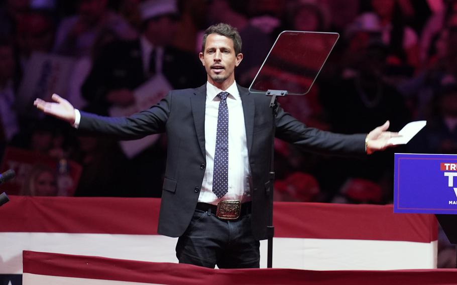 Tony Hinchcliffe stands before a rally crowd at Madison Square Garden.