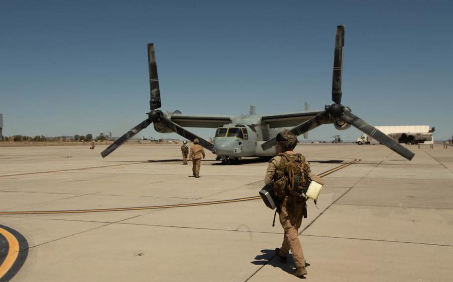 Marines of Marine Aviation Weapons and Tactics Squadron 1 prepare for flight aboard an MV-22B Osprey at Marine Corps Air Station Yuma, Ariz., on April 8, 2022. 