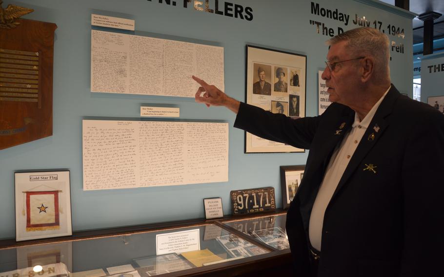 Ken Parker, a co-founder of the Bedford Boys Tribute Center, pointing to letters regarding then-Capt. Taylor Fellers on display May 10, 2024. One letter is from Fellers to his mother on March 27, 1943, and the other letter is dated June 29, 1944, from a family in France who thought Fellers’ family knew he died on D-Day. 