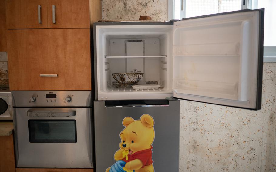 An empty refrigerator that would normally be full before Ramadan is seen in the home Abu Hussam, who said he couldn’t find work locally and ended up joining a local battalion of fighters. He requested to be identified by his nickname for fear of retribution by authorities.