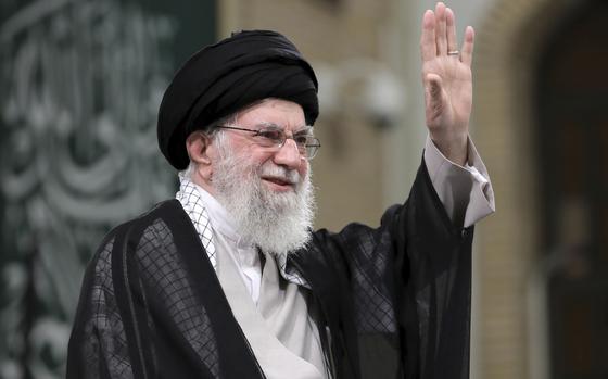 In this photo released by an official website of the office of the Iranian supreme leader, Supreme Leader Ayatollah Ali Khamenei waves to the crowd during a meeting with school and university students, in Tehran, Iran, Saturday, Nov. 2, 2024. (Office of the Iranian Supreme Leader via AP)