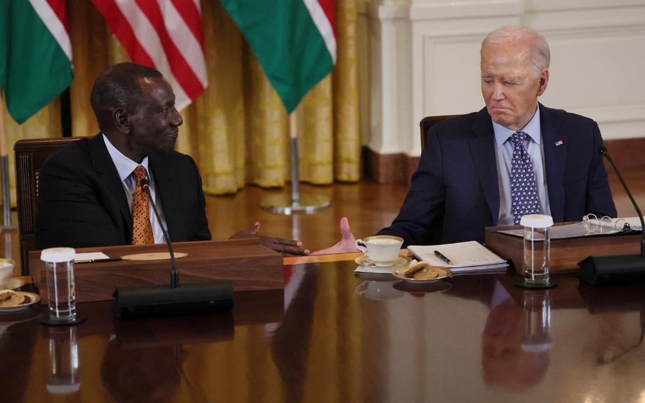 U.S. President Joe Biden goes in for a handshake during event with Kenyan President William Ruto and business executives at the White House, in Washington, U.S., May 22, 2024. 