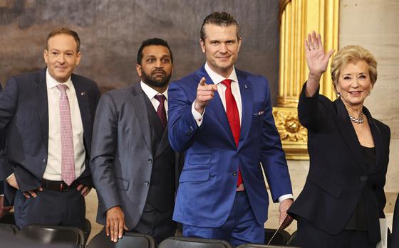 From left, Lee Zeldin, administrator of the Environmental Protection Agency nominee; Kash Patel, FBI director nominee; Pete Hegseth, secretary of defense nominee; and Linda McMahon, education secretary nominee; gesture after the 60th Presidential Inauguration in the Rotunda of the U.S. Capitol in Washington, Monday, Jan. 20, 2025. (Chip Somodevilla/Pool Photo via AP)