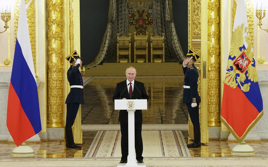 This pool photograph distributed by Russian state agency Sputnik shows Russia’s President Vladimir Putin delivering a speech during a ceremony to receive credentials from newly appointed foreign ambassadors to Russia at the Kremlin in Moscow on Dec. 4, 2023.