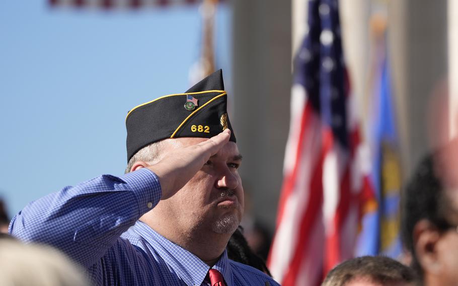 An attendee salutes