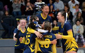 The Ansbach Cougars celebrate their DODEA-Europe Division III volleyball title after defeating Brussels 25-11, 25-18, 25-18, at Ramstein Air Base, Germany, Nov. 2, 2024.