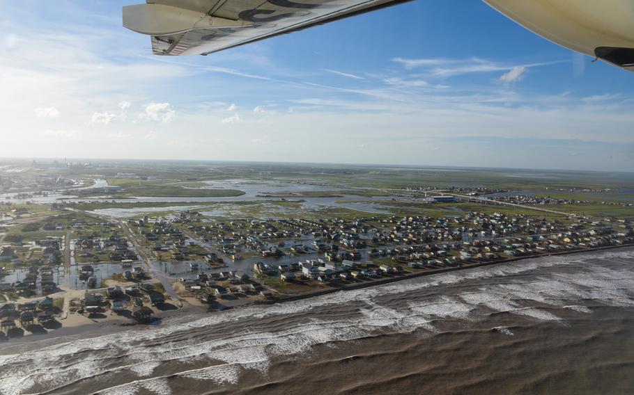 A Coast Guard Air Station Corpus Christi HC-144 Ocean Sentry air crew conducts fly-overs in Texas after Hurricane Beryl, July 8, 2024.  Capt. Keith Donohue, commanding officer of Coast Guard Sector Houston-Galveston, joined the mission to assess damage impacts from Hurricane Beryl. 