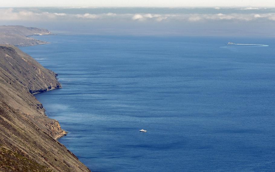 A U.S. Navy destroyer cuts a circuitous path during a training exercise off the east coast of San Clemente Island in 2013.