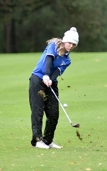 Nora Hacker hits the ball.