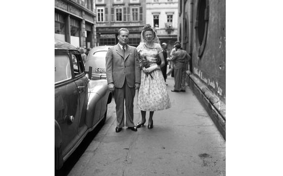 HED: Nice day for a floral wedding, 1948

Heidelberg, Germany, June 19, 1948: Mary Joan Liddle of Wallasey, Cheshire, England, former secretary to the managing editor of Stars and Stripes, and Sheridan Louis Moyer, of Wheeling, W. Va., are heading to the Providence Church in Heidelberg to get married. Mr. Moyers is chief mechanical adviser to the chief of ordnance, EUCOM.

Stars and Stripes’ staff photographers were often called upon to do double duty as wedding photographers for their love-struck colleagues as romances blossomed in post-war Germany. The archives staff digitized a few of them,  but Mary Joan and Sheridan remain our favorite. 

Read more at: https://www.stripes.com/history/archive_photo_of_the_day/2022-10-03/heidelberg-germany-wedding-1948-7562471.html
Source - Stars and Stripes
