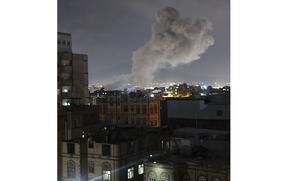 Smoke rises from a location reportedly struck by U.S. airstrikes in Sanaa, Yemen, Saturday, March 15, 2025. (AP Photo/Osamah Abdulrahman)