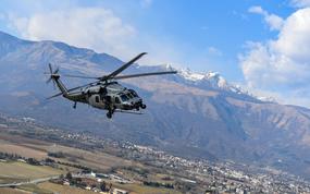 A U.S. Air Force HH-60G Pave Hawk helicopter operated by the 56th Rescue Squadron flies over Aviano Air Base, Italy, Feb. 12, 2020. Airmen from Aviano bid farewell to the Pave Hawk on Dec. 18, 2024, as it flew its final active-duty mission before the base's transition to the HH-60W Jolly Green II. 