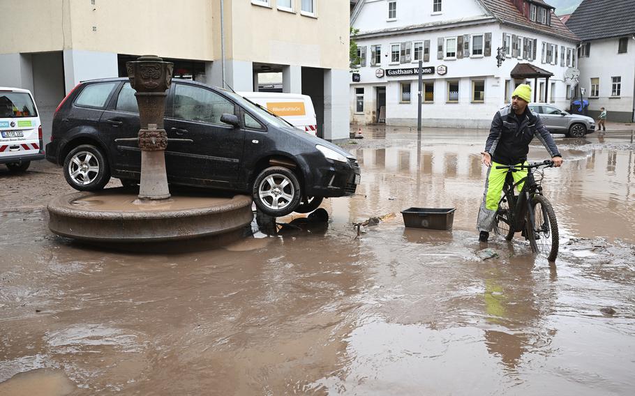 A car washed away by floodwaters rests on a well in Rudersberg, Germany, on June 3, 2024. Persistent heavy rain led to widespread flooding in the southern states of Bavaria and Baden-Württemberg over the weekend.