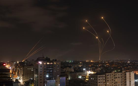 FILE - Rockets fired from Gaza and intercepted by Israel's Iron Dome anti-missile system over Israeli skies are seen from Gaza City, on May 13, 2023. (AP Photo/Fatima Shbair, File)