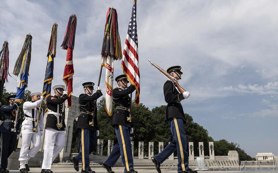 The Armed Forces Color Guard arrives for the 20th anniversary celebration of the National World War II Memorial in Washington, May 25, 2024.